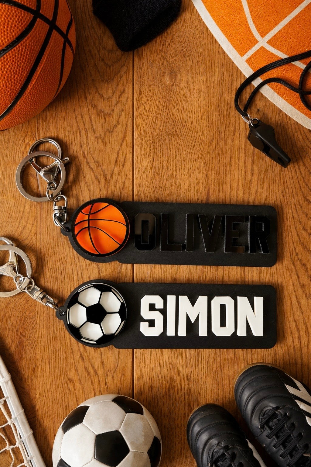 Personalised elongated basketball and soccer keyrings in laser cut acrylic with a name