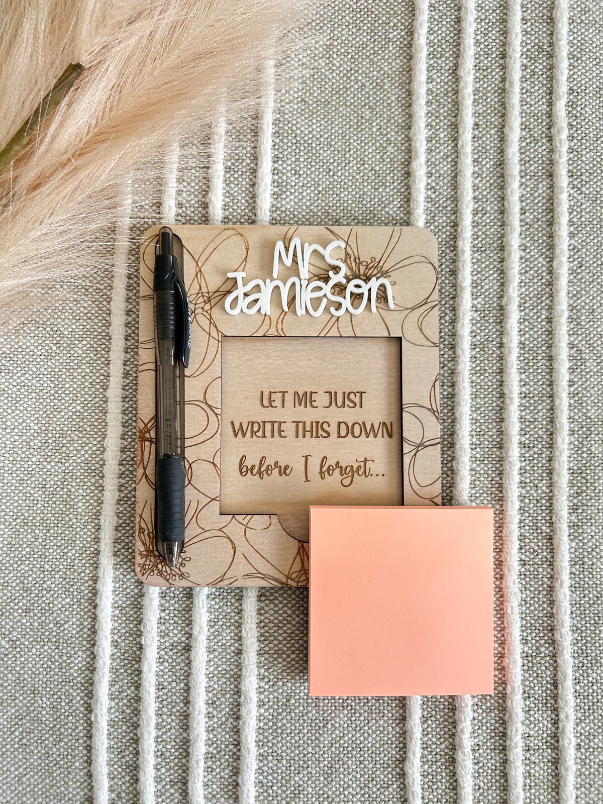 Personalised wooden sticky note and pen holder with an engraved acrylic name plate