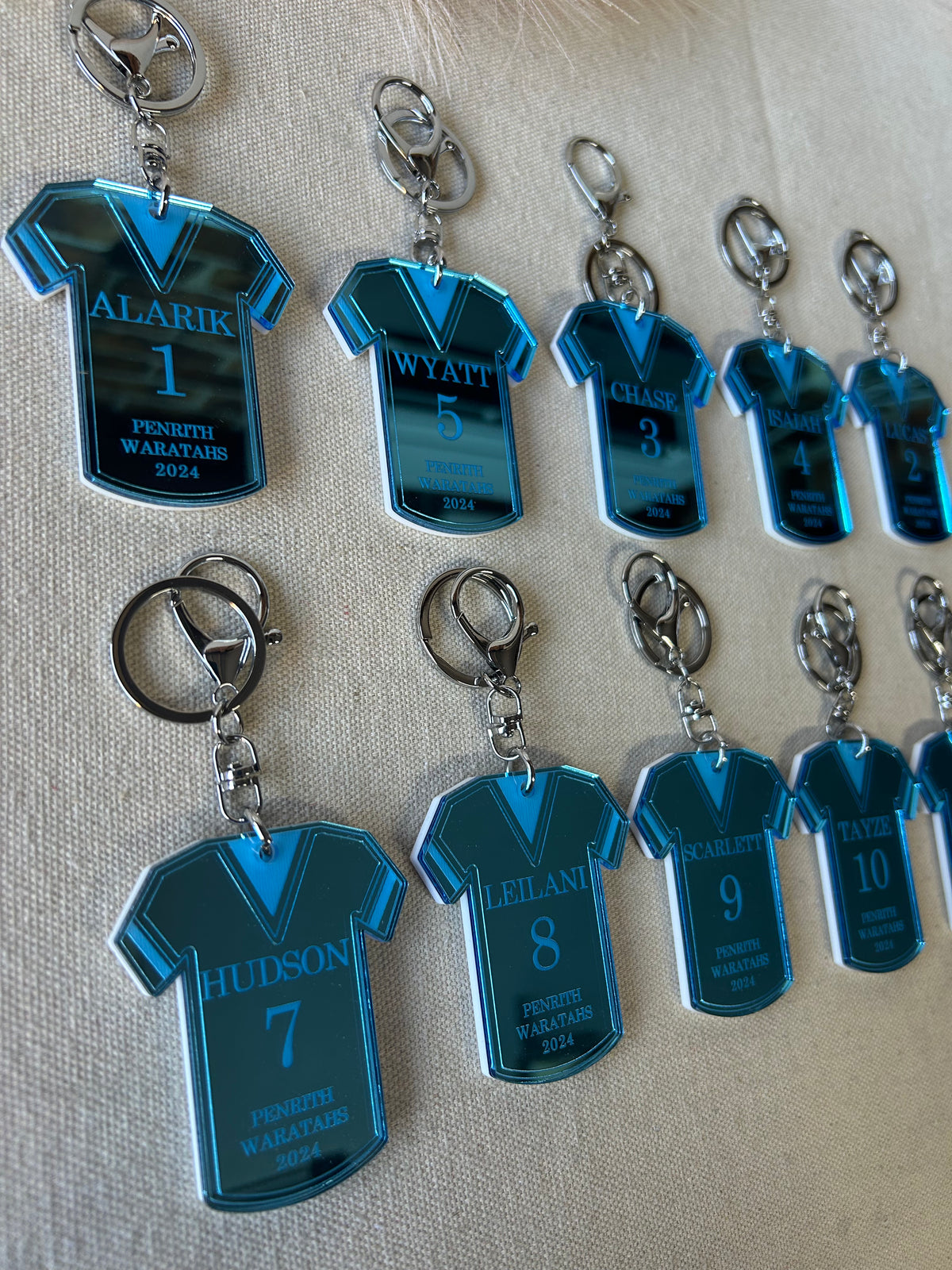 Personalised football jersey keyring in double layered mirrored acrylic, engraved with player name, position and club