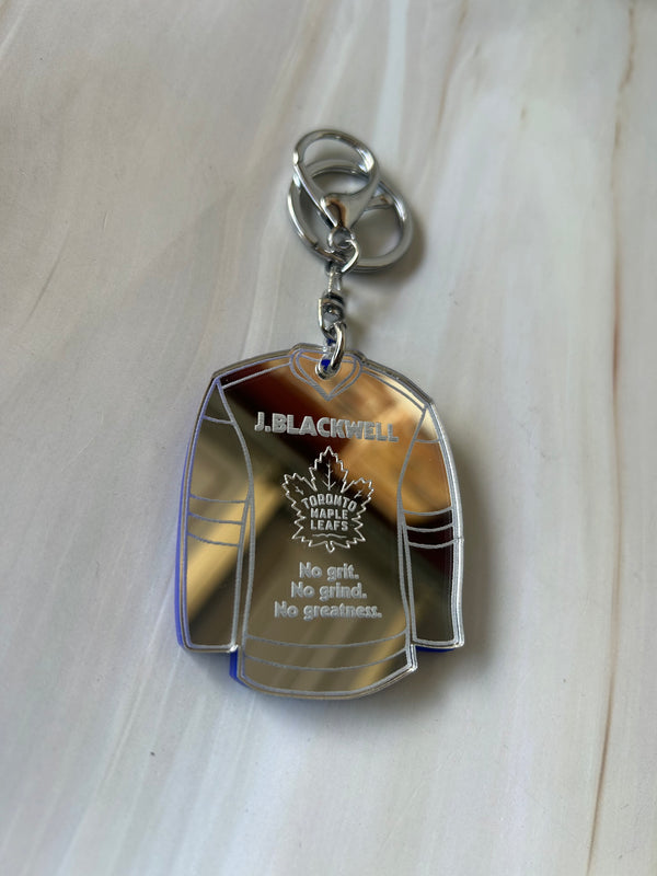 Personalised hockey jersey keyring in mirrored acrylic with name, position and club