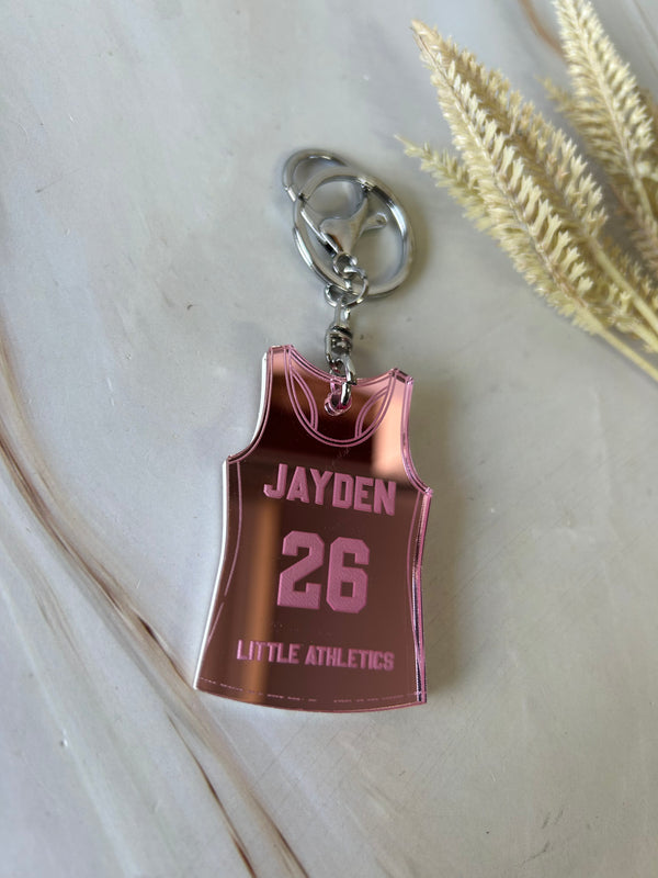 Personalised track singlet keyring in double layered mirrored acrylic with name and club