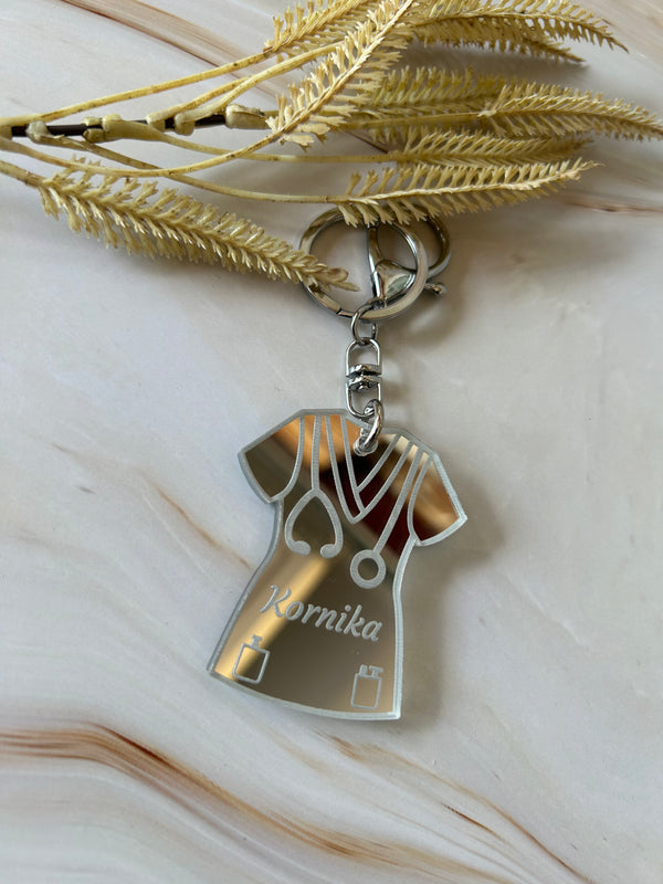 Personalised nurse scrubs keyring in double layered mirrored acrylic, engraved with their name