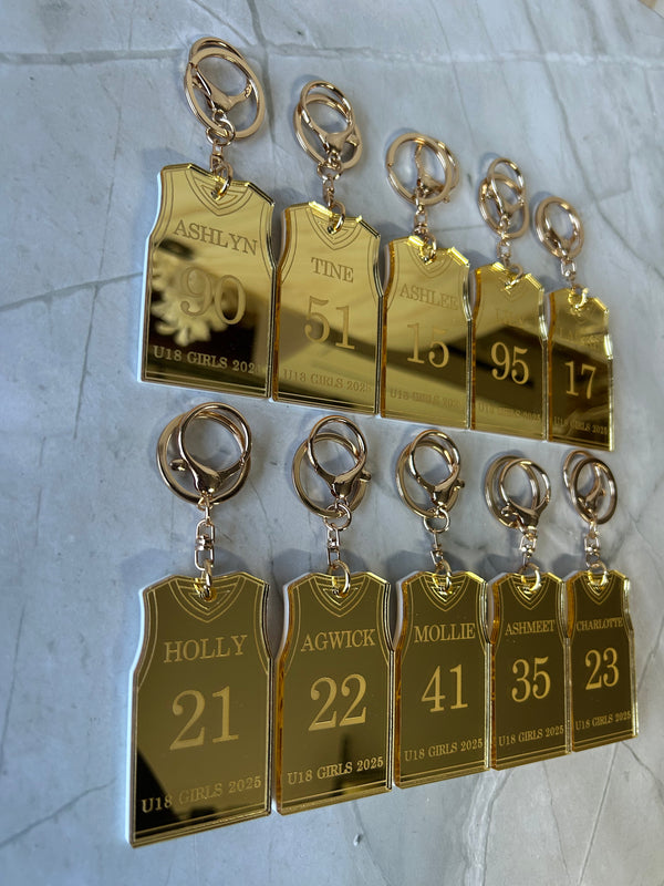 Personalised basketball jersey keyring in double layered mirrored acrylic, engraved with player name, position and club