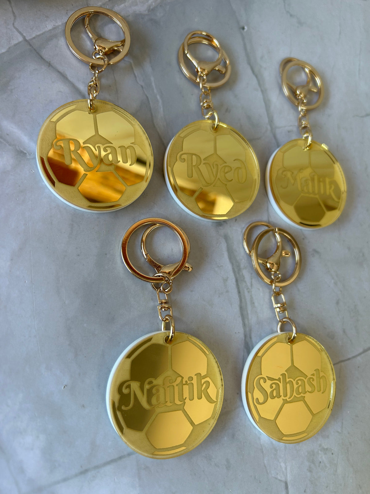 Personalised sporting keyring with name and team colours in laser-cut acrylic, choose your sport