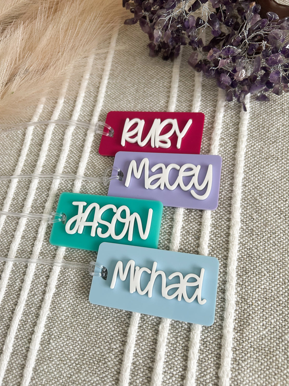 Personalised acrylic bag tags laser cut in Sydney in your choice of colour and name
