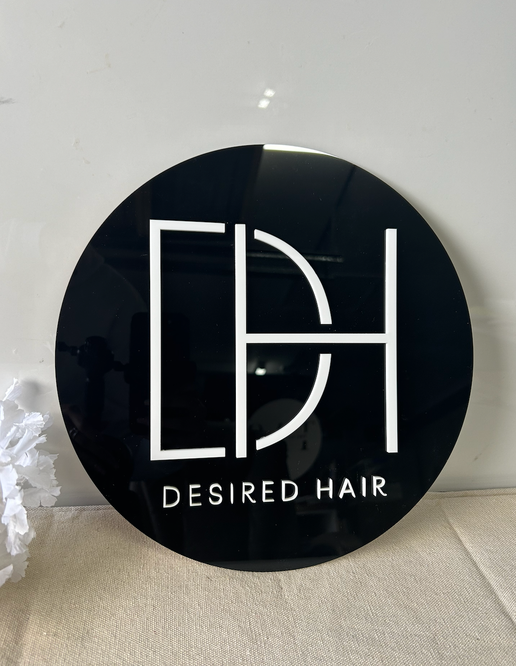 Custom 30cm round acrylic business sign made from a company logo