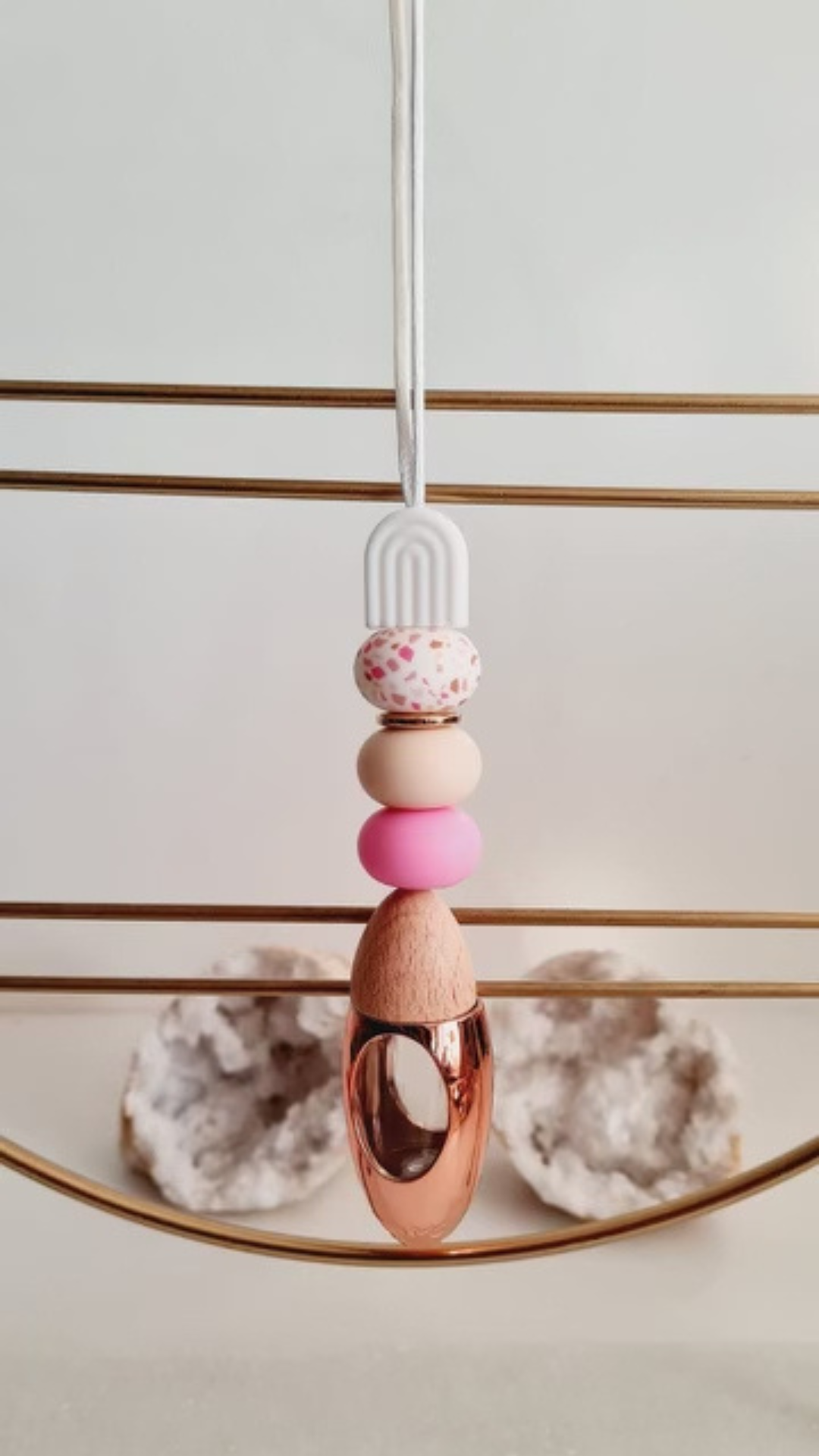Terra personalised acrylic car diffuser hanging from a rear view mirror