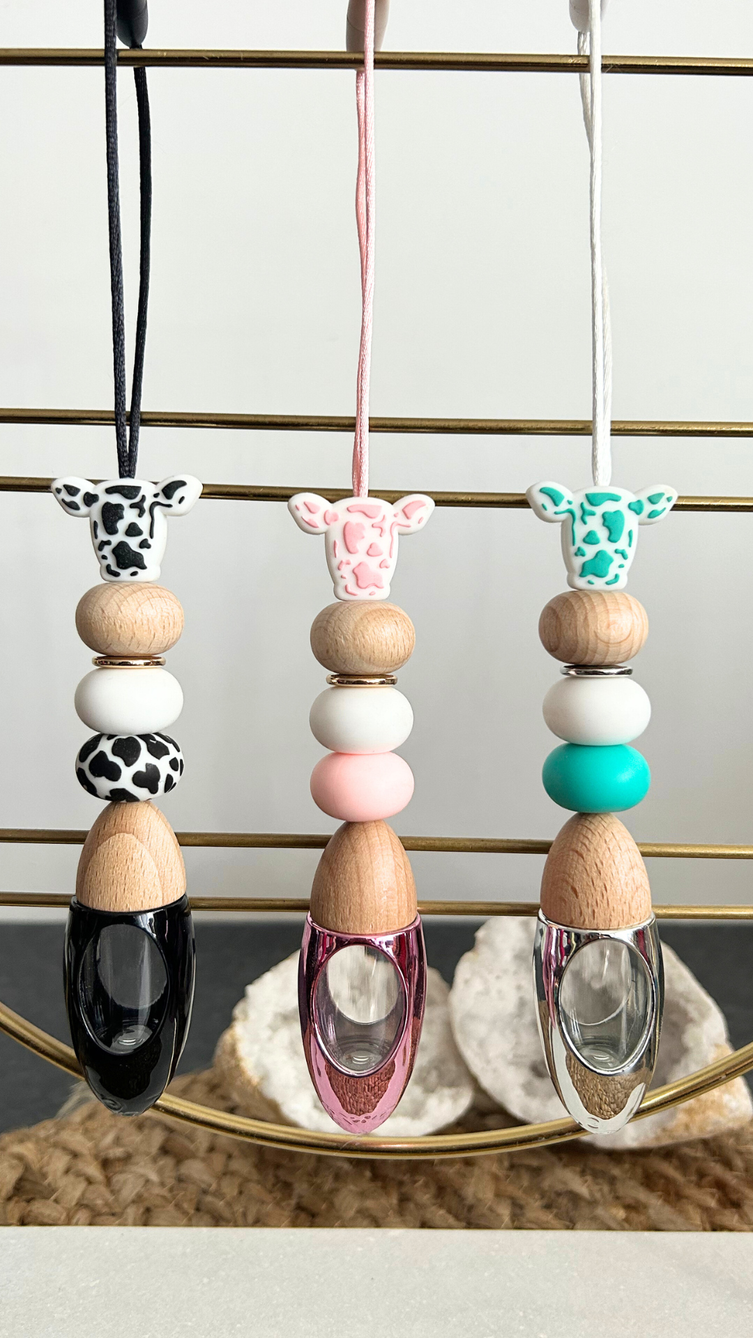 Cow print silicone beaded car diffuser with a wooden lid, hanging air freshener