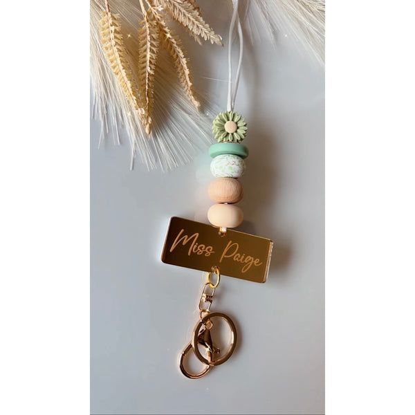 Thalia silicone beaded lanyard with a personalised engraved mirrored acrylic piece
