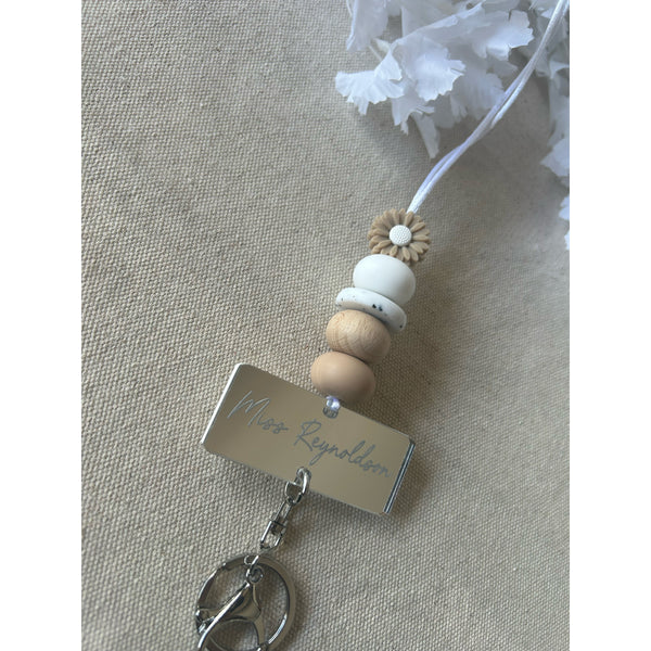 Oak silicone beaded lanyard with a personalised engraved mirrored acrylic piece