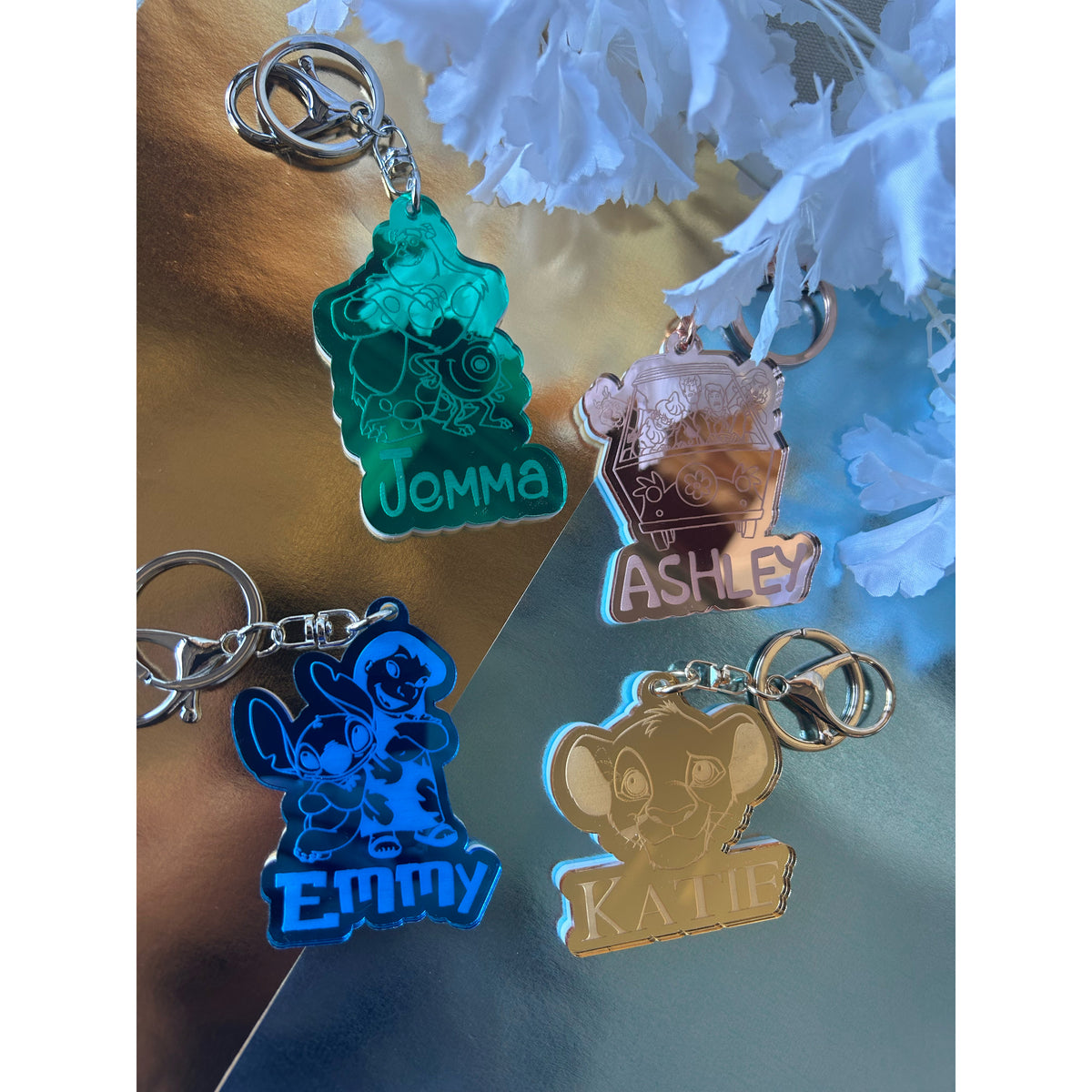Personalised nostalgic movie keyrings in mirrored acrylic including Lion King and Lilo and Stitch