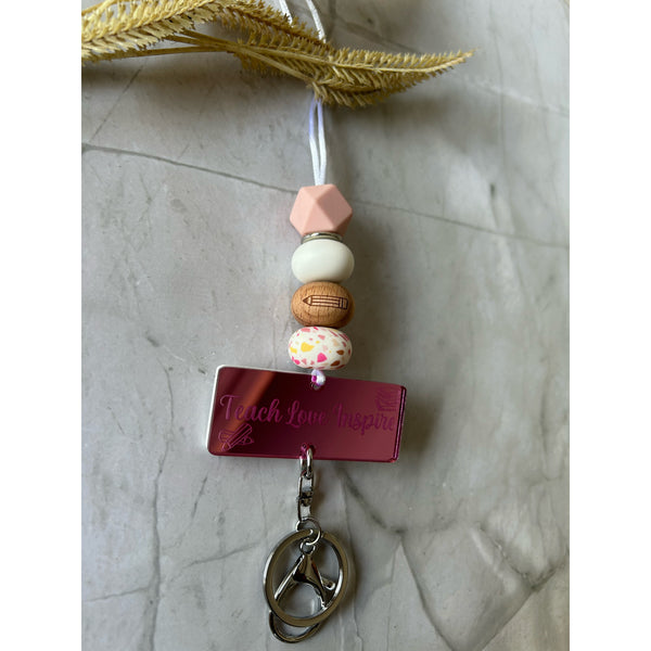 Mack silicone beaded lanyard with a personalised engraved mirrored acrylic piece