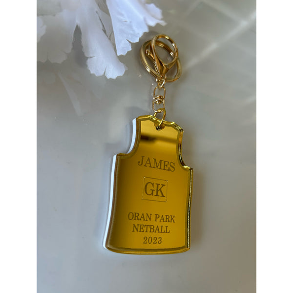 Personalised netball singlet keychain in double layered acrylic with name and club