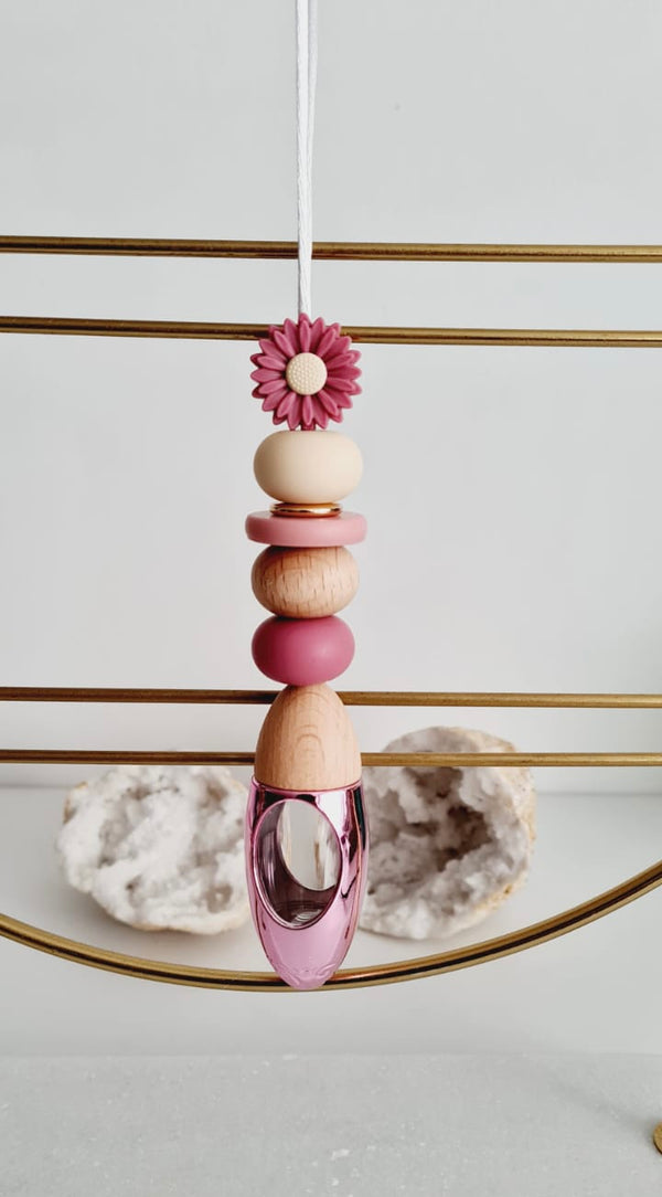 Victoria personalised acrylic car diffuser hanging from a rear view mirror