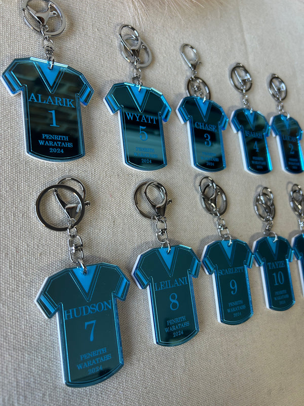 Personalised football jersey keyring in double layered mirrored acrylic, engraved with player name, position and club