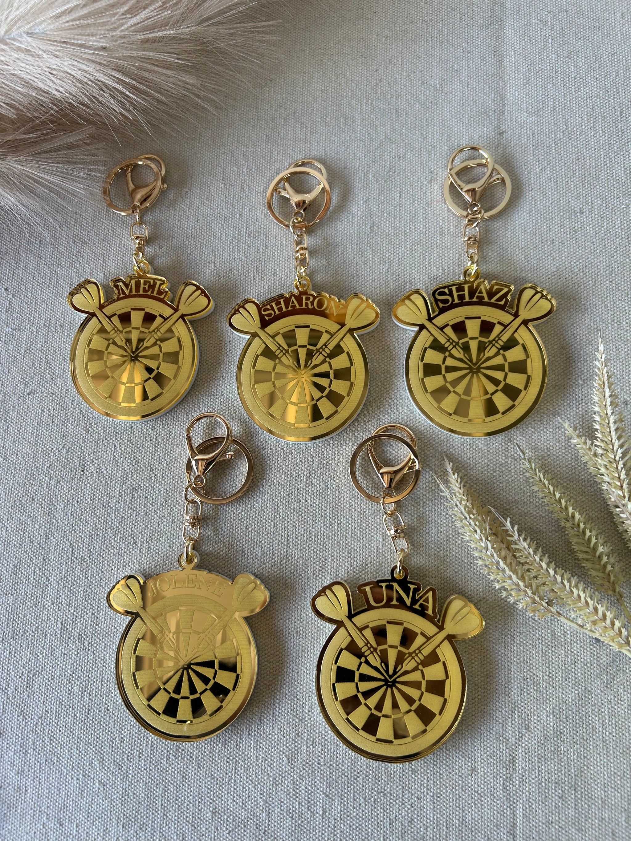 Personalised darts keyring in double layered mirrored acrylic, engraved with the player's name