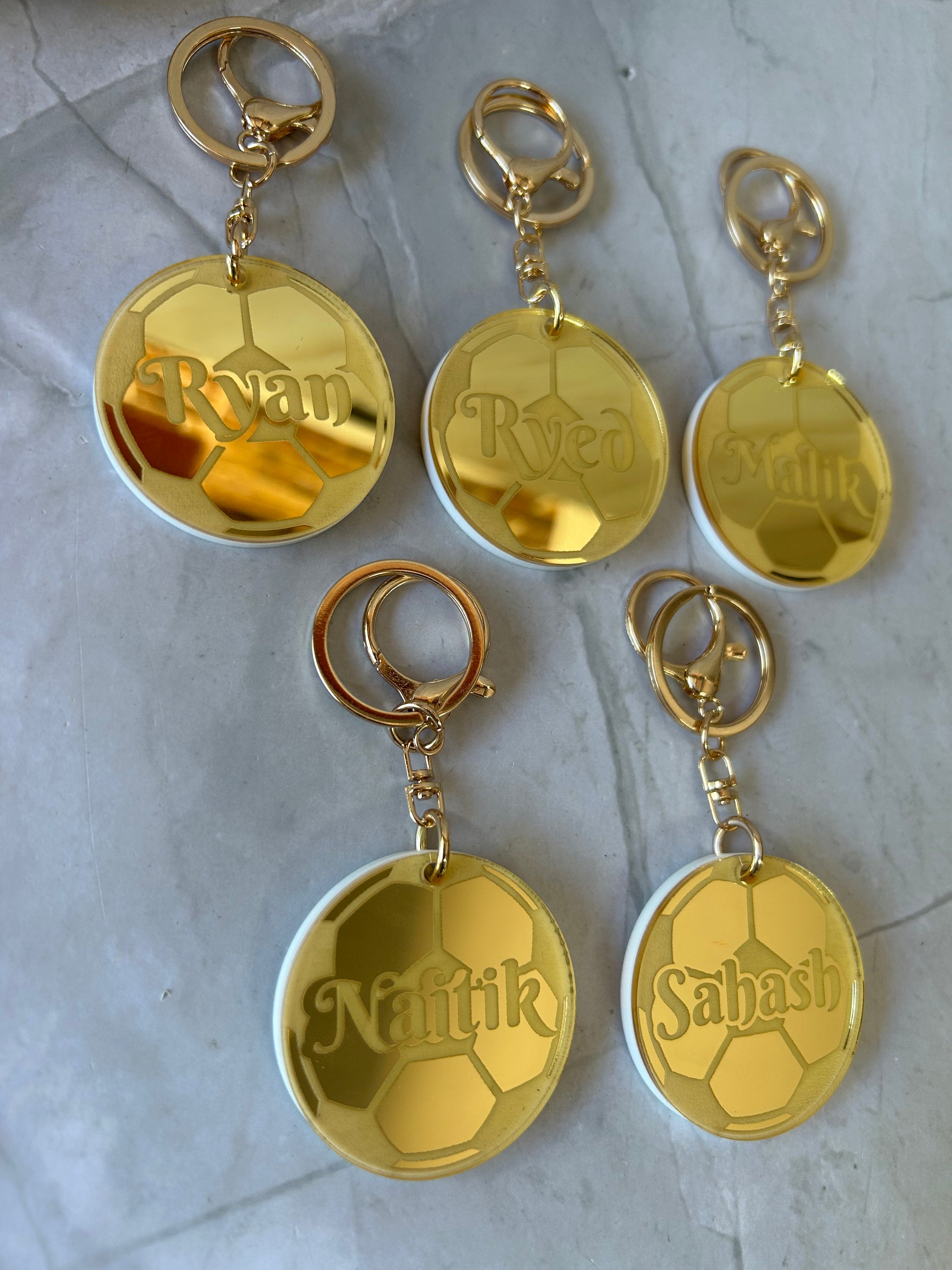 Personalised sporting keyring with name and team colours in laser-cut acrylic, choose your sport