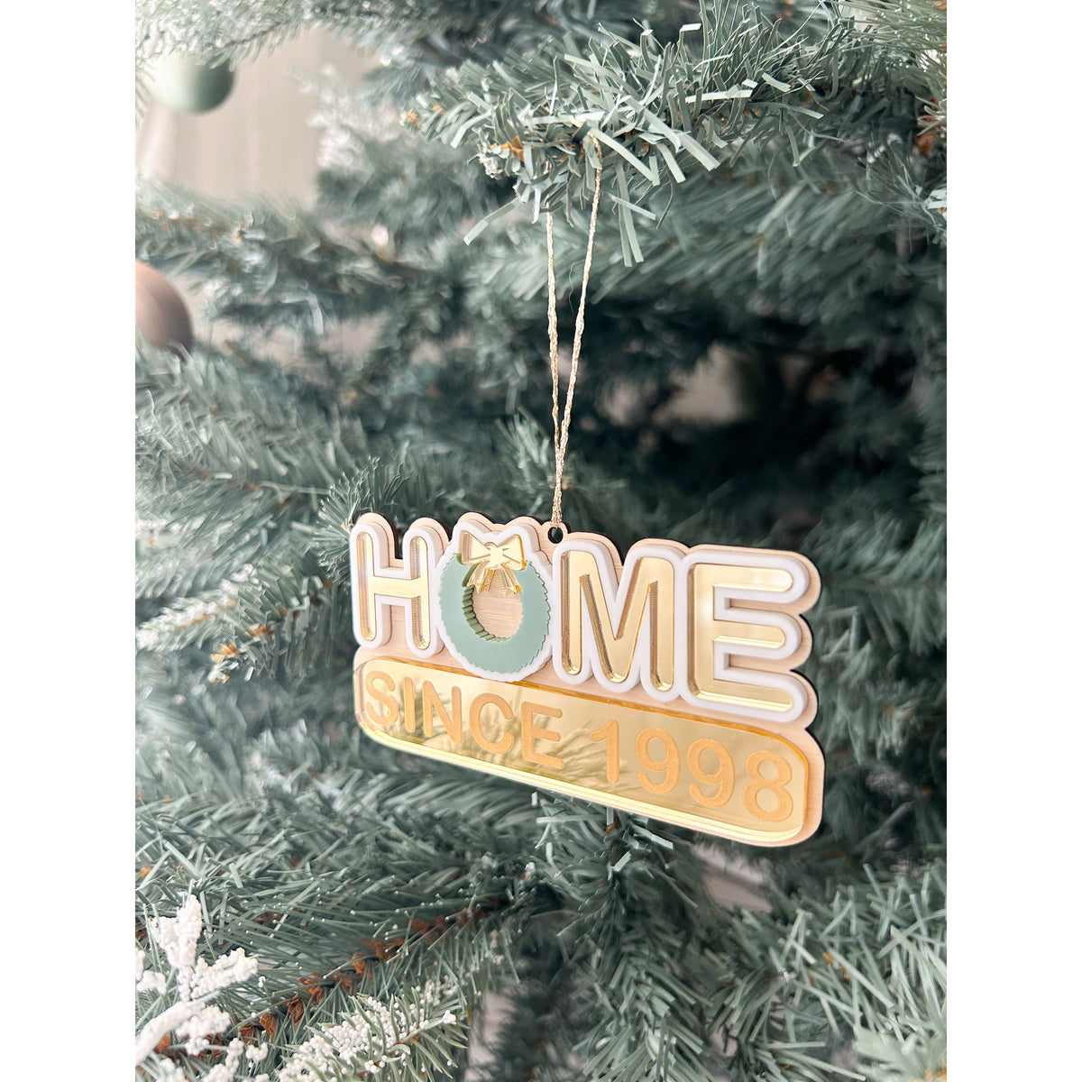 Our Home Christmas bauble in wood and acrylic with the year you moved in