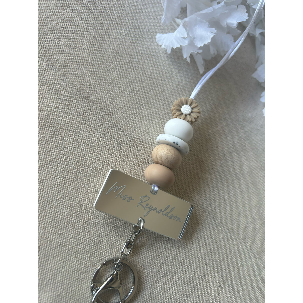 Oak silicone beaded lanyard with a personalised engraved mirrored acrylic piece