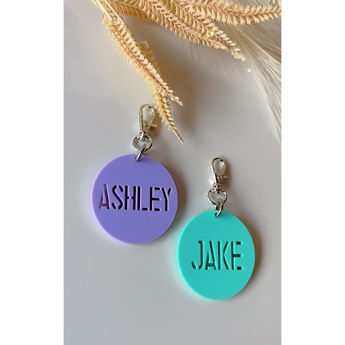 Personalised round acrylic bag tag, 5cm, engraved with a name, handmade in Sydney